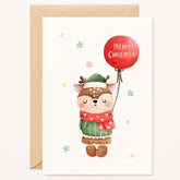 Christmas card with a cartoon deer holding a red balloon with 'Merry Christmas' text, on a white background.